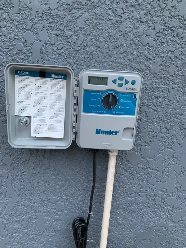 Hunter X-CORE digital irrigation system controller box installed in New Smyrna Beach