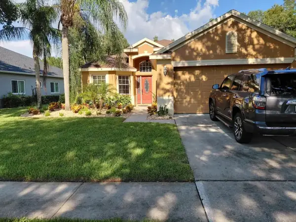 Sanford home exterior with new landscaping and stone beds